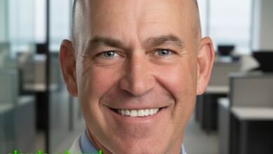 Portrait of Claude Edward Elkins Jr., Executive Vice President and Chief Commercial Officer at Norfolk Southern, standing confidently, symbolizing leadership in modern rail logistics and transformation in the freight industry